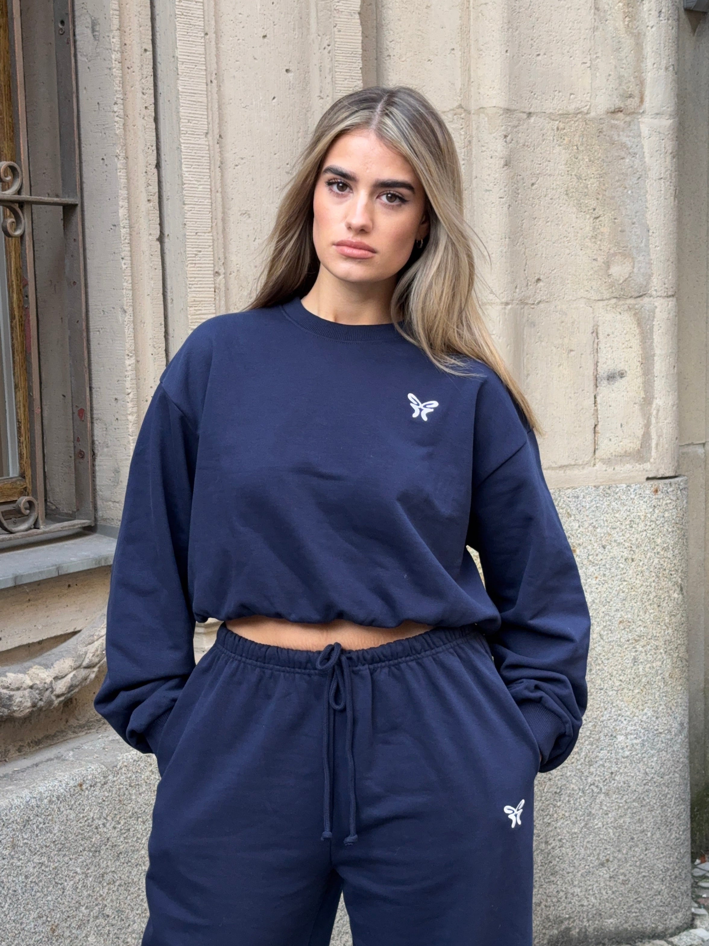 Women's navy cropped crew neck sweatshirt with long sleeves