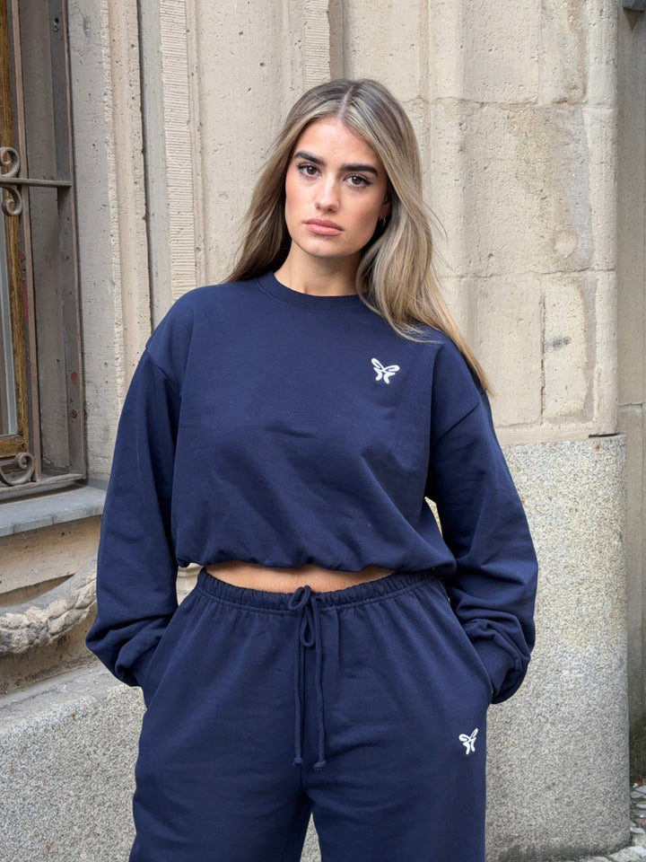 Women's navy cropped crew neck sweatshirt with long sleeves