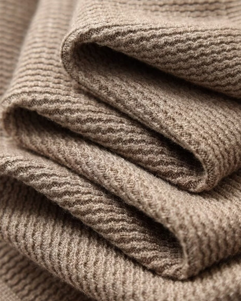 Men's textured knit polo sweater with open V-neck collar and long sleeves