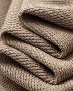 Men's textured knit polo sweater with open V-neck collar and long sleeves