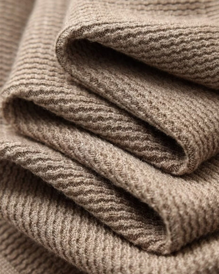 Men's textured knit polo sweater with open V-neck collar and long sleeves