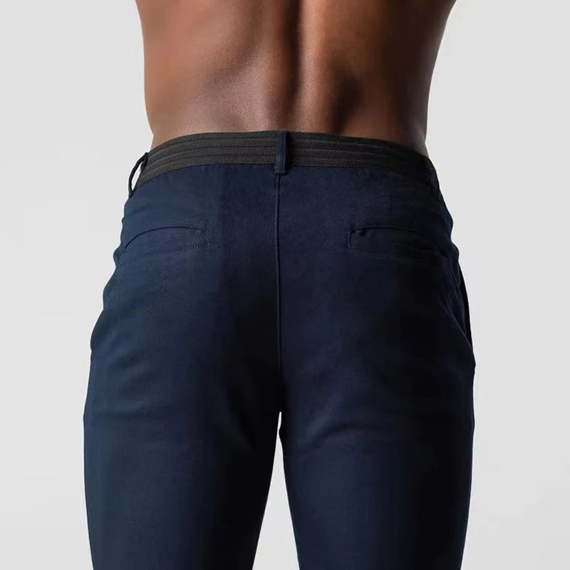 Men's slim tapered chinos trousers shown in black and navy with side pockets