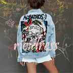 Women's light blue denim jacket with Halloween skull and rose graphic on the back