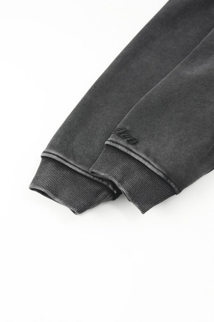Men's black zip-up hoodie jacket with front pockets and vintage finish
