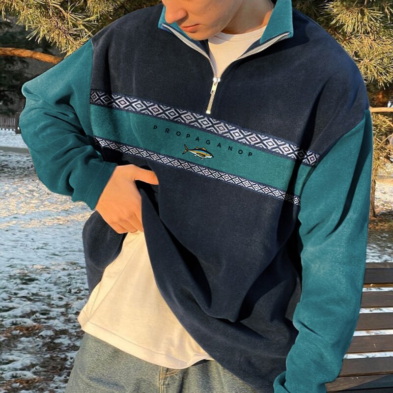 Men's geometric half-zip mock neck sweater with contrasting panels