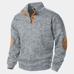 Men's textured knit sweater with mock neck and contrast elbow patches