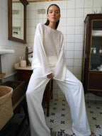 Women's open-knit oversized sweater with wide sleeves and crew neck