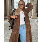Women's long brown trench coat with lapel collar and button fastening