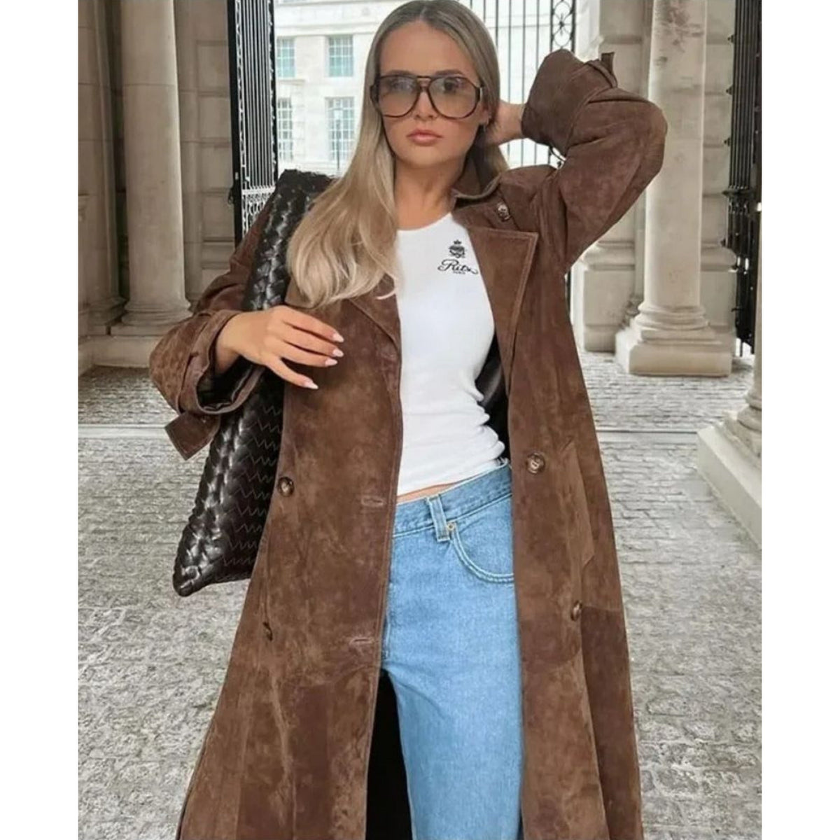 Women's long brown trench coat with lapel collar and button fastening