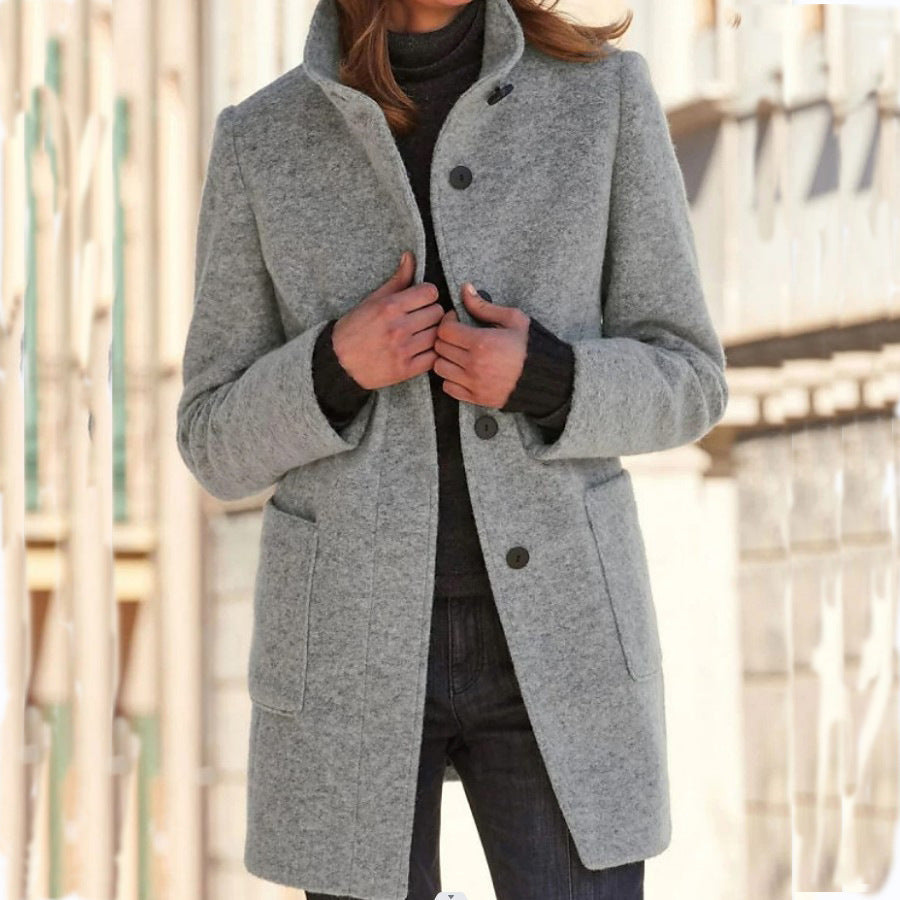 Women's button front coat with raised collar, long sleeves and front pockets