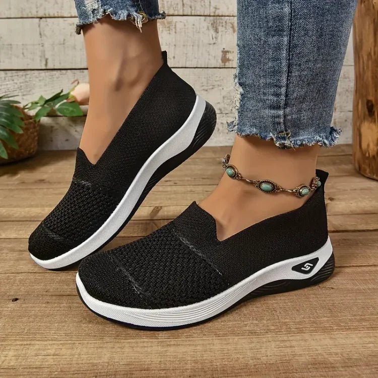 Women's knit slip-on sneakers with textured panels and white soles