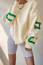 Women's crew-neck sweatshirt with contrasting letter graphics on the sleeves