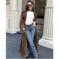 Women's long brown trench coat with lapel collar and button fastening
