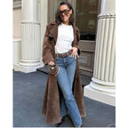 Women's long brown trench coat with lapel collar and button fastening