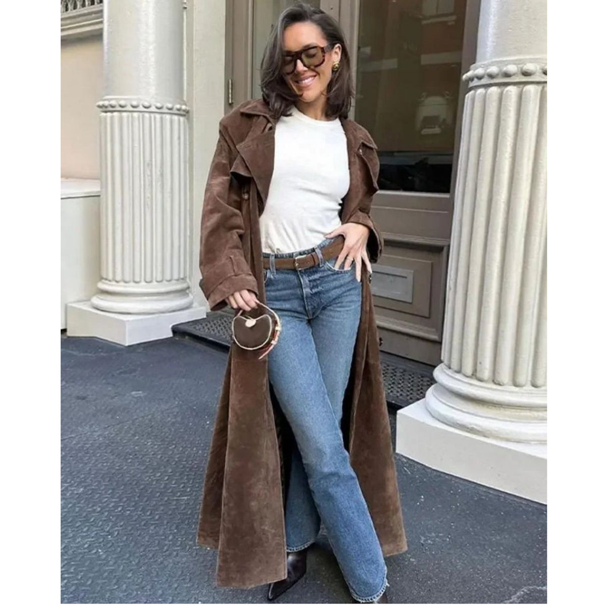 Women's long brown trench coat with lapel collar and button fastening