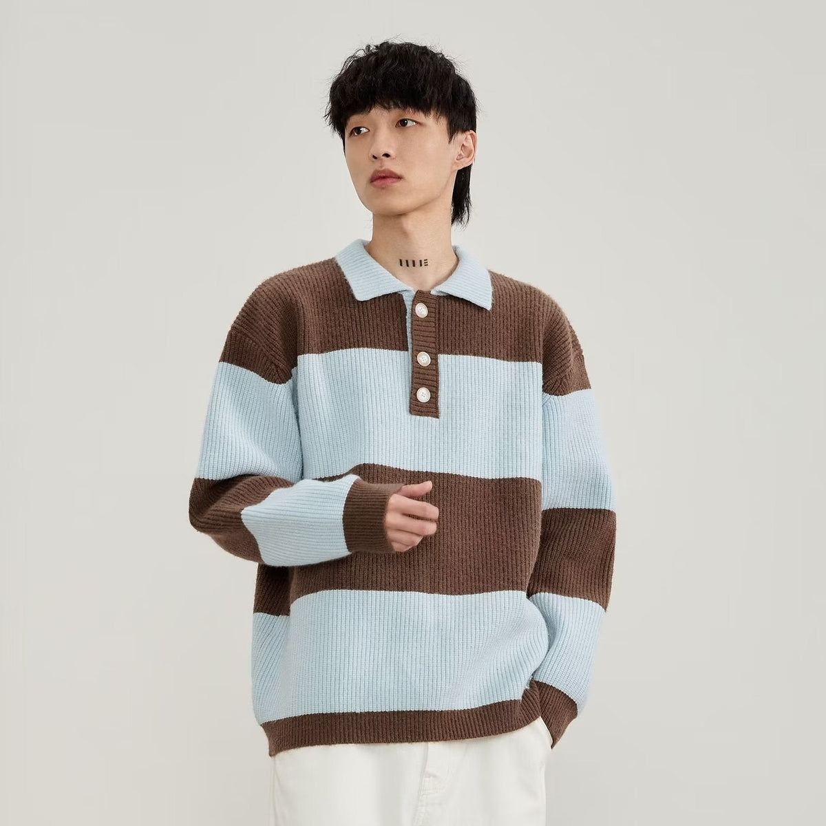 Men's black and cream striped polo sweater with long sleeves and button placket