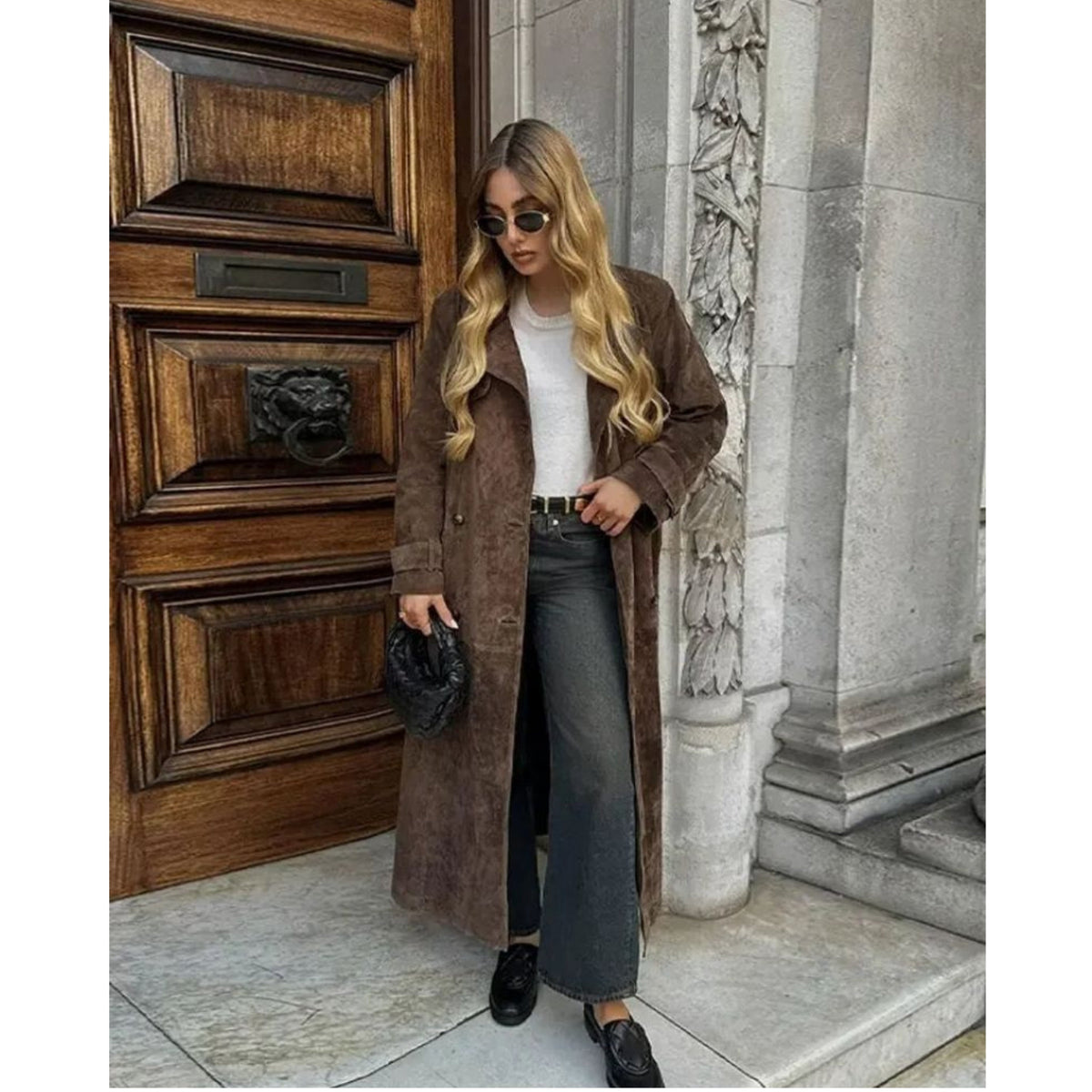 Women's long brown trench coat with lapel collar and button fastening