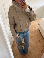 Women's beige cropped double-breasted trench jacket with high collar and belted cuffs