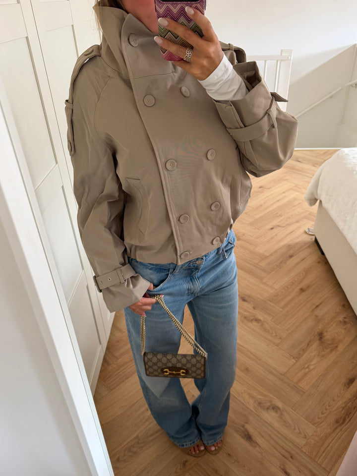 Women's beige cropped double-breasted trench jacket with high collar and belted cuffs