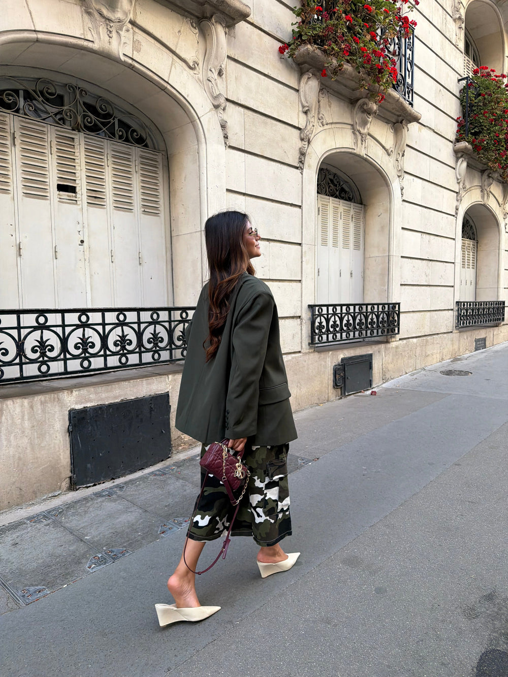 Women's deep green relaxed blazer with notched lapels and long sleeves