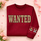 Graphic crew neck sweater with WANTED front print and personalised sleeve artwork