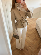Women's beige cropped trench coat with high collar and waist belt