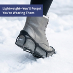 Black stretch ice cleats with traction chains fitted over boots