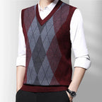Men's sleeveless argyle V-neck sweater vest layered over a white shirt