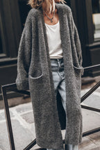 Women's oversized open front knit midi cardigan with long sleeves and front pockets
