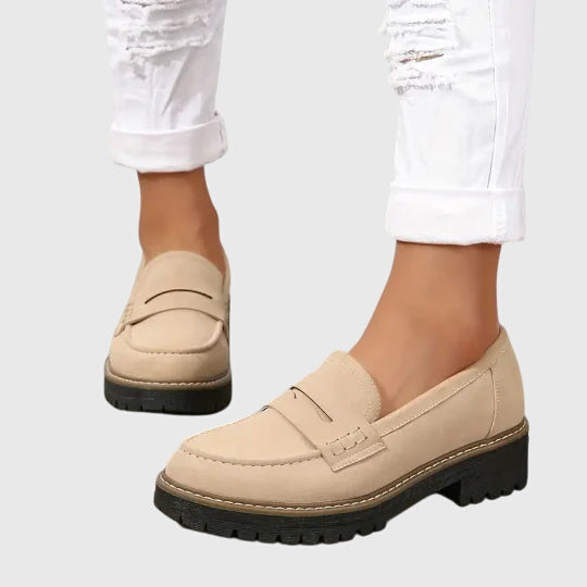 Women's penny loafers with round toes and low lug soles