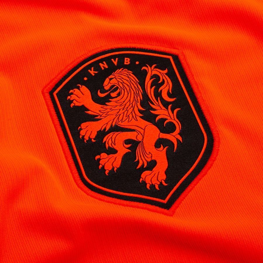 Orange men's Netherlands home football shirt with black trim and crest
