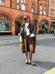 Women's brown long trench coat with wide lapels and cape-style sleeves