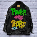 Graphic denim jacket with colourful Halloween-style artwork on the back