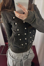 Women's black fitted hoodie with studded front trims and zip fastening