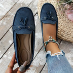 Women's flat moccasin loafers with decorative lacing and rounded toes
