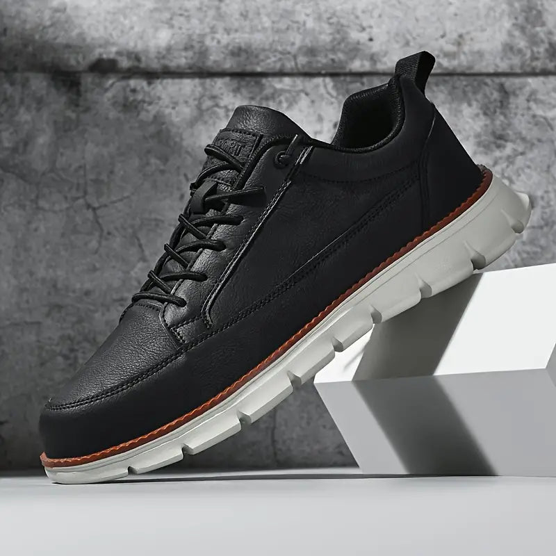 Low top lace-up sneaker with stitched panels and chunky textured sole