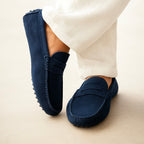 Men's suede boat loafers with rounded moc toe and penny strap detail