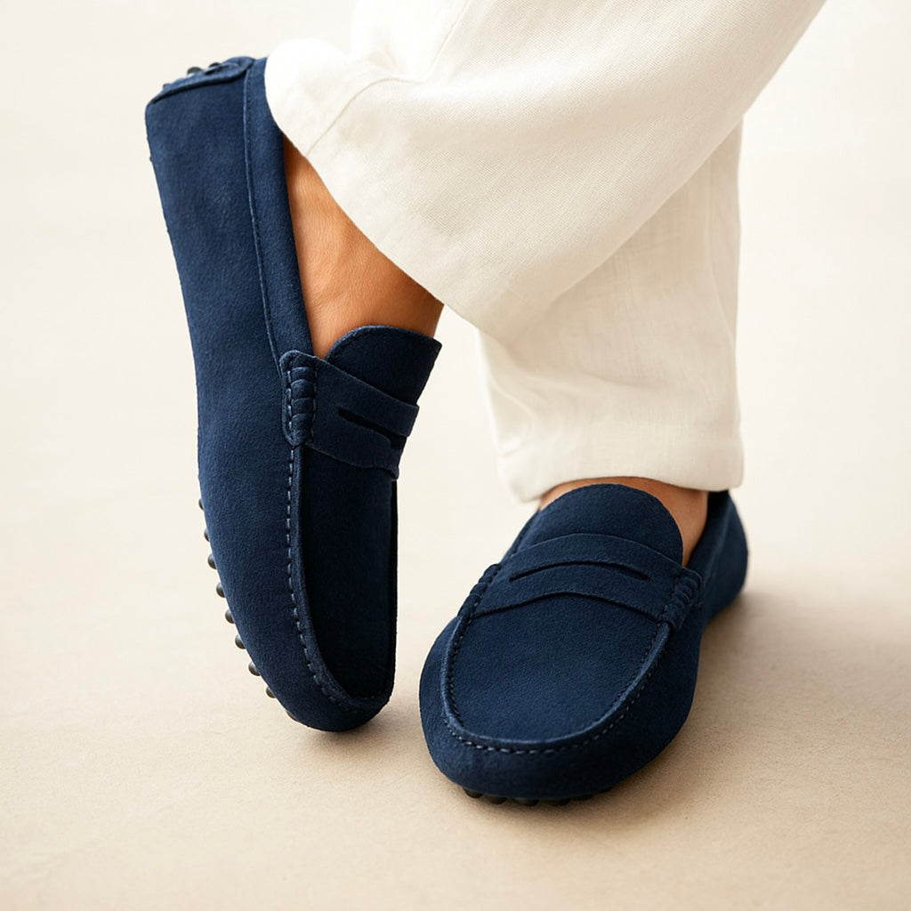 Men's suede boat loafers with rounded moc toe and penny strap detail