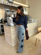 Women's light blue wide leg jeans with studded star leg details