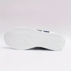Women's white lace-up sneakers with dark side stripes
