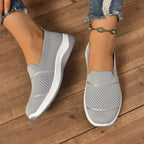 Women's knit slip-on sneakers with textured panels and white soles