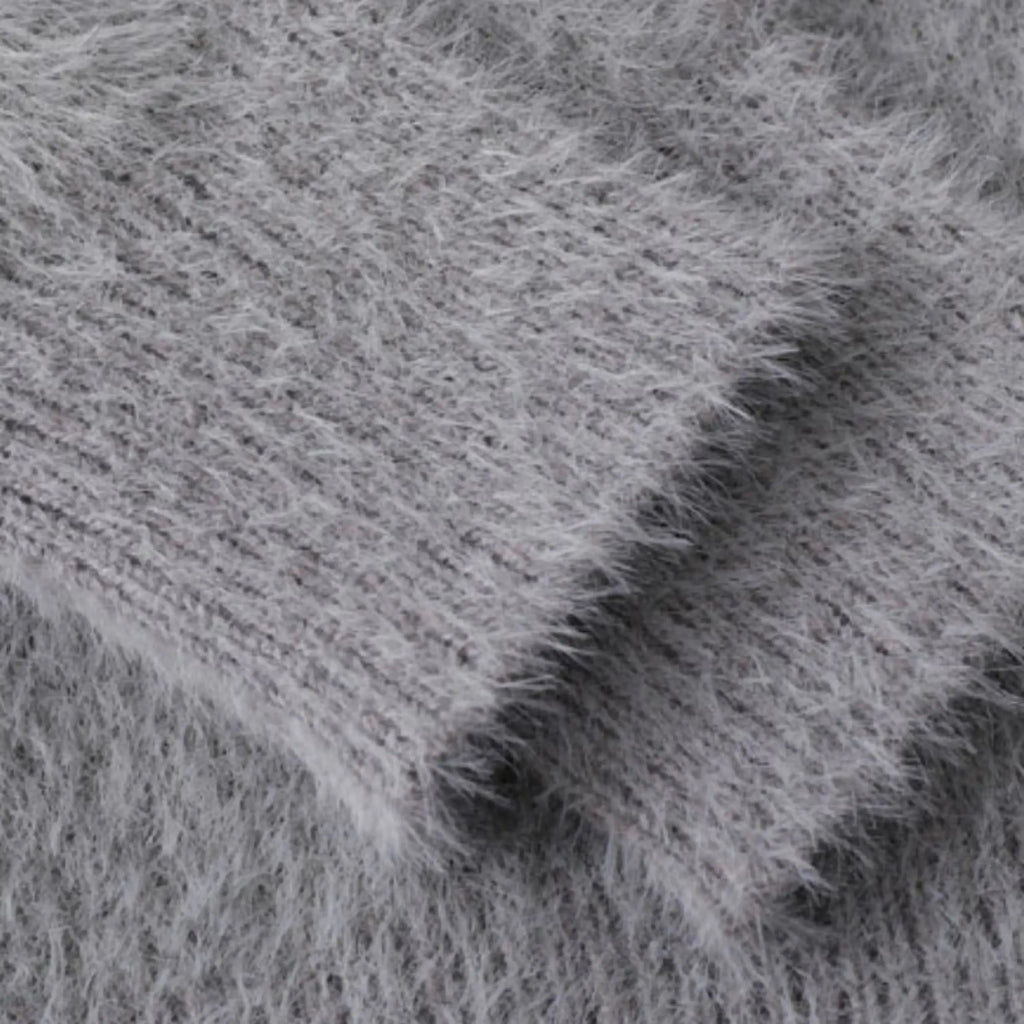 Unisex knitted sweater with crew neck, long sleeves and abstract contrast motif