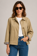 Women's beige short trench jacket with button front and checked turn-back cuffs