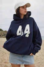 Women's oversized pullover hoodie with number graphic and kangaroo pocket