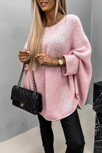 Women's loose knit poncho sweater with crew neckline and wide sleeves