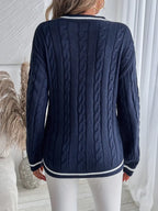 Women's navy cable knit V-neck sweater with contrast striped trims