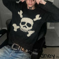 Men's black sweater with a cream skull and crossed-bones graphic