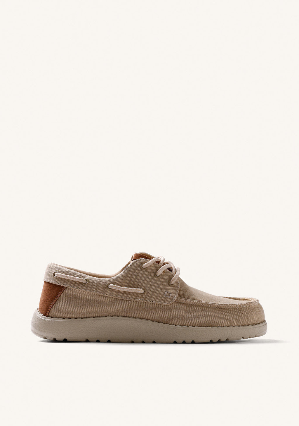 Beige canvas Wallabee loafers with lace-up fronts and moc toes