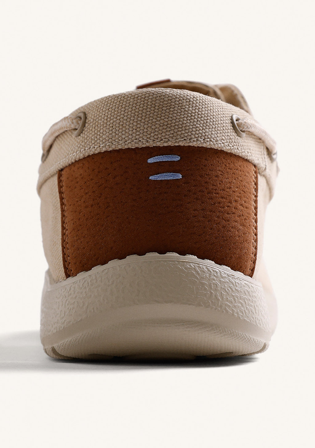 Beige canvas Wallabee loafers with lace-up fronts and moc toes