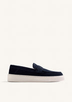 Navy slip-on penny loafers with decorative strap detail and contrasting flat soles